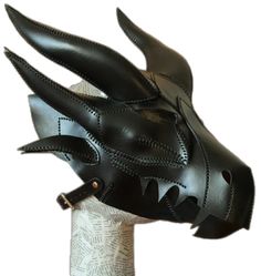 a black leather mask with spikes on it