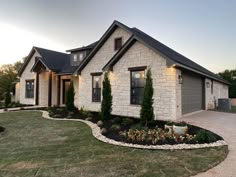 a house with landscaping in the front yard