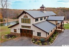 an aerial view of a large house in the country