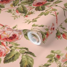 a pink floral wallpaper with roses on it