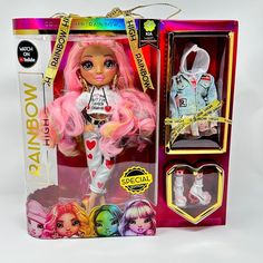 the doll is in its box and has pink hair