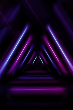 an abstract purple and black background with neon lights in the dark, that is very colorful