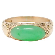 Centering an oval-shaped jade cabochon measuring 7.5 x 15.5 mm  Translucent pastel green with subtle mottling flush set east to west Flanked by engraved cartouche motif shoulders Featuring an engraved scroll motif surround  With high polish finish Stamped for 14 karat gold With maker's mark for Allsopp Bros. Circa: 1905 Ring Size: 9 1/4 and sizable Measures north to south 8.0 mm and sits 6.0 mm high Total Weight: 7.1 grams Stock Number: We-13152 Art Nouveau Ring, The Crown Jewels, Gold Signet Ring, Art Deco Engagement, Deco Engagement Ring, Art Deco Engagement Ring, Crown Jewels, Jade Stone, Maker's Mark