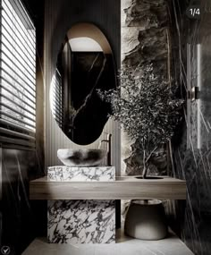 a bathroom with black and white marble walls