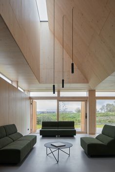 a living room with two couches and a coffee table in the middle of it