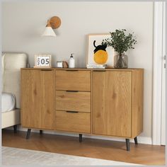 a wooden cabinet with two drawers in a room