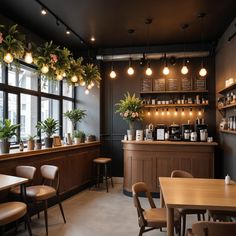 the interior of a coffee shop with tables, chairs and potted plants hanging from the ceiling