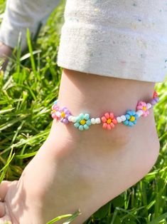 Flower Ankle Bracelet 🌸☀️ Made with 3mm seed beads and clear, durable cord Customize as you wish, add to Personalization Section CARING TIPS FOR YOUR JEWELRY ⭐️Treat and store with care. ⭐️ For longevity, avoid exposing your jewelry to water. ⭐️ Avoid having direct contact with lotions, perfumes, sanitizers as these chemicals may cause discoloration of your jewelry. Summer Anklets, Ankle Jewelry, Beaded Anklets, Anklet Jewelry, Flower Child, Ankle Bracelets, Rainbow Flowers, Flower Seeds, Body Jewelry