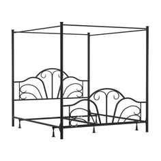 an iron bed frame with four posts