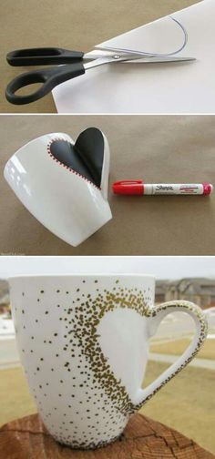 coffee cup with scissors and paint on it sitting next to a heart shaped teacup