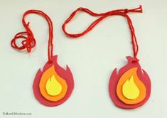 two red and yellow fire shaped tags on a string