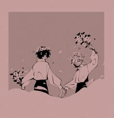 two people holding hands with flowers in their hair