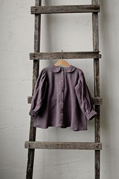 This tunic dress is made of 100% soft medium weight linen.  Details: - Choose size and embroidery in the drop down menu - Colour: Mauve - Composition: 100% Oeko-Tex certified linen - Peter pan collar - Puff sleeves - Coconut buttons in the front - Medium weight linen - Linen care: machine wash gentle; tumble dry low, ironing optional - The price is for one tunic, other pictured items are not included Fashion Work Outfit, Pan Collar Dress, Linen Tunic Dress, Girls Tunics, Peter Pan Collar Dress, Stylish Coat, Cute Cardigans, Dress Linen, Dress For Girls