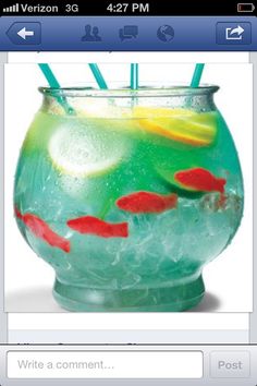 goldfish in a fish bowl with drinking straws