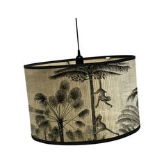 a lampshade with an animal print on it and a black cord hanging from the ceiling