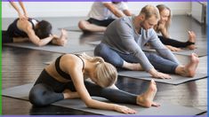 a group of people doing yoga on mats