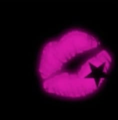 a black and pink photo with a star on it's lip in the dark