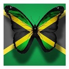 a butterfly that is sitting on top of a green and yellow background with the flag of jamaica