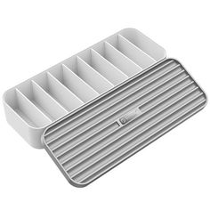 a white tray with compartments on top of it