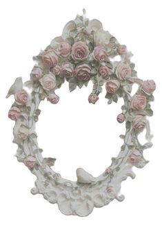 a white frame with pink roses and birds on it's sides, in the shape of a wreath