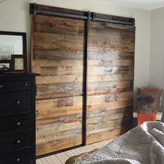 an image of a bedroom with wooden doors