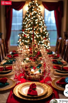 a dining room table set for christmas dinner with a tree in the background and lights on