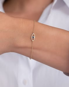 Beautifully handcrafted 14k gold evil eye bracelet with pave diamond and a blue sapphire center. Uber chic and timeless, available in yellow, white and rose gold, perfect solo or stacked. Size of Evil Eye: Approx. 13mm(W) by 6mm(H) Chain Length: 6" - 7" Adjustable Diamond Carat Weight: Approx. 0.06 (ct. tw) Blue Sapphire Carat Weight: Approx. 0.07 (ct. tw) Total Weight: Approx. 1 gram Ships in 4-7 business days Rush orders ship in 2-4 business days Comes gift ready in a custom Zoe Lev jewelry bo Evil Eye Dainty Jewelry, Delicate Diamond Jewelry, Delicate Bracelet Diamond, Silver Hand Bracelet, Evil Eye Gold Bracelet, Evil Eye Jewelry Bracelet, Evil Eye Bracelet Silver, Evil Eye Bracelet Gold, Silver Evil Eye Bracelet