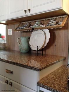 the kitchen counter is clean and ready for us to use it's dish rack