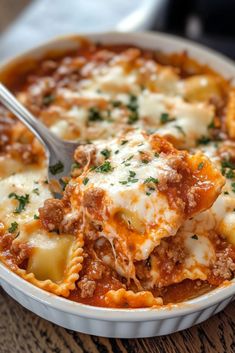 Ingredients:  1 (25 oz) bag of frozen cheese ravioli 1 lb ground beef 1 jar (24 oz) marinara sauce 1 cup ricotta cheese 1 cup sour cream 2 cups shredded mozzarella cheese ½ cup grated Parmesan cheese 1 tsp garlic powder 1 tsp Italian seasoning Fresh parsley for garnish (optional) Instructions:  Preheat oven to 375°F (190°C). Grease a 9x13 baking dish. Cook ground beef until browned; drain and mix with marinara sauce. In a bowl, combine ricotta, sour cream, garlic powder, and Italian seasoning. Layer half of the ravioli, meat sauce, and ricotta mixture in the dish. Repeat layers. Top with mozzarella and Parmesan cheese. Bake for 25-30 minutes until bubbly and golden. Garnish with parsley if desired. Prep Time: 15 mins | Cook Time: 30 mins | Total Time: 45 mins | Kcal: 480 | Servings: 6 Million Dollar Ravioli, Ravioli Casserole, Pasta Types, Cheese Bake, Cheese Ravioli, 9x13 Baking Dish, Yummy Comfort Food, Fair Food Recipes, Meat Sauce