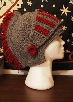 a crocheted hat on top of a mannequin head