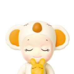 a small toy with an elephant on it's back and eyes closed, sitting in front of a white background