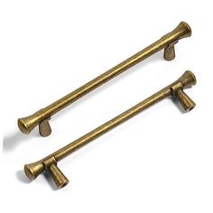 two antique brass door handles on white background