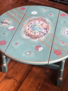 a painted table with a clock on it