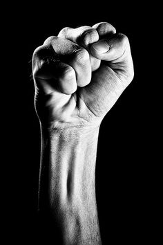 a black and white photo of a fist