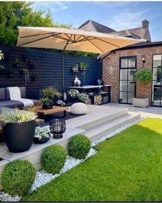 an outdoor patio with potted plants and furniture