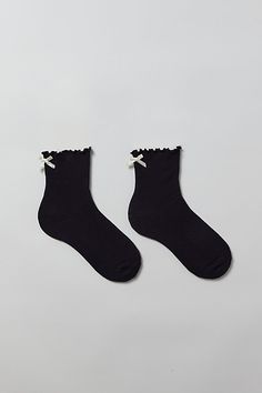 So soft socks in a cozy ribbed knit with a ruffled lettuce edge. Finished with a satin bow at the ankle for an extra-sweet touch. Features Ribbed knit ruffle & bow crew socks So-soft statement socks Cozy-knit crew socks Lettuce edge ruffle along the ankle Satin ribbon bow at the back Content + Care 70% Cotton, 28% polyester, 2% spandex Machine wash Imported Size + Fit Crew sock length Fits US women’s shoe size 6–10 | Ribbed Knit Ruffle & Bow Crew Sock in Black, Women's at Urban Outfitters Socks Ruffle, Ruffle Socks, Ruffled Socks, Xmas List, Crew Sock, Black Socks, Satin Bow, Crew Socks, Lettuce