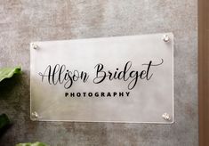 a sign that says, allison bridalt photography on the side of a wall