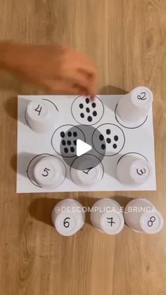 a person is placing numbers on a piece of paper to make it look like they are counting