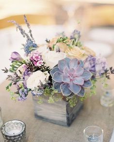 an image of a table setting with flowers and candles on the table for a social post