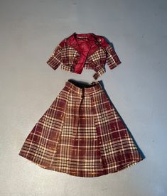 ITEM DESCRIPTION A very precious, wool tartan plaid, vintage doll set which includes a silk lined blazer and a matching long skirt. Machine sewn. The buttons are also covered in silk. In excellent condition with one tiny pin hole in the lapel, no other damage or repairs.  Please note the following item specifics: OVERALL SIZE IN INCHES: BLAZER:  Neck to hem 4.5"  Sleeve length 3.5" Shoulder 4" across SKIRT: Waist to hem 9" Waist circumference 8" Hem circumference 26" COLOR: Multi colored plaid YEAR:c1920 OVERALL CONDITION (SEE SCALE BELOW): CONDITION: C7-Excellent MATERIAL:Wood, silk CONDITION GRADING SCALE: C10-New, never used. C9-Mint C8-Near mint C7-Excellent C6-Very good  C5-Good Blazer Skirt Set, Retro Knee-length Plaid Skirt, Retro Plaid Lined Skirt, Retro Plaid Cotton Skirt, 1970s Plaid Skirt, Vintage Plaid Cotton Skirt, Blazer And Skirt Set, Pin Hole, Blazer And Skirt