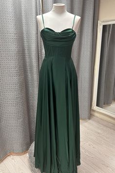 This dark green, formal dress is crafted from luxurious satin fabric. It features an A-line silhouette with an elegant cowl neck bodice and streamlined spaghetti straps. It comes complete with a zip-up back and built-in bra for extra comfort and support. SKU: 3317 Dark green color Satin material A-line silhouette Cowl neck bodice with spaghetti straps Zip-up back Built-in bra Ship in 7-10 business days Size: US 2-16. We offer free returns in 7 days. Please refer to our return policy page for mor Dark Green Formal Dress, A Line Formal Dress, Green Formal Dress, Prom Dress A Line, Dress Stores, Dark Green Dress, Formal Wear Dresses, Prom Dress Stores, Mob Dresses