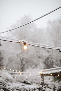 a street light is covered in snow