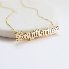 Beautiful and lovely Sagittarius script letter pendent necklace in gold color. Soft and warm. Your item will ship in a gift box. Please feel free to contact me if you have any question. ♥ Sagittarius (Birth date: November 22 - December 21) ♥ Chain length 14"- 20" ♥ Pendent  3/8" x 1 7/8" ♥ Gold plated over brass  ♥  See more Rudiana Accessories  Rudiana.etsy.com Letter Pendent, Sagittarius Pendant, Script Necklace, 22 December, 22 November, Constellation Necklace, Zodiac Necklace, December 21, Zodiac Jewelry