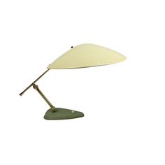 a table lamp with a white shade on it's head and a green base