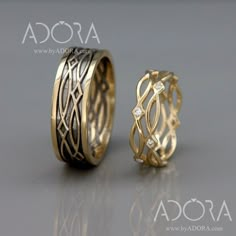 two gold rings with diamonds on them sitting next to each other in front of a gray background