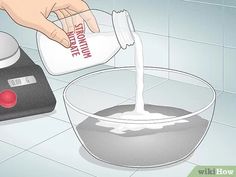 someone pouring milk into a bowl on top of a scale