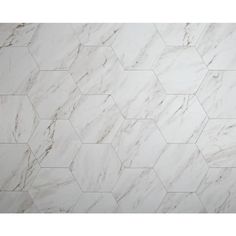 a white marble tile with hexagonal pattern