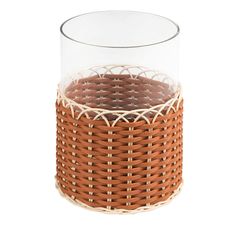 a glass and wicker vase on a white background