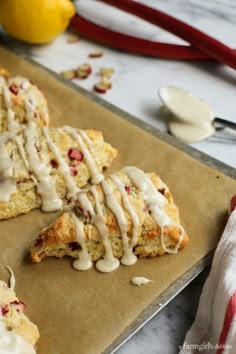 lemon scones with icing on a baking sheet