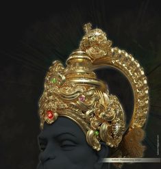 the head of a statue with a gold crown on it